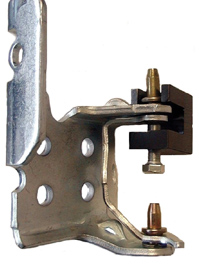 the black u-shaped piece on top of this hinge is a pin removal tool that allows a repairer to push the pins out versus pound them out, avoiding damage to the hinge.