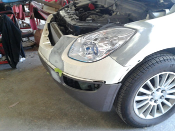 This is a 2013 Buick Enclave I mocked up in order to make sure the headlamp fit before repairing the fender.