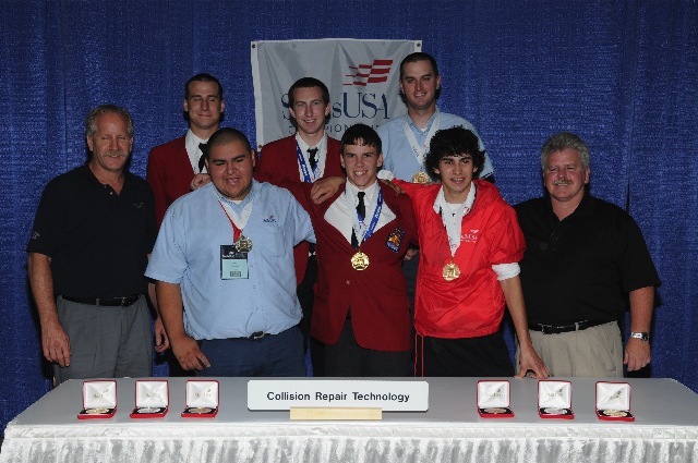 Front row L to R: Technical Committee member Dennis Barrett, medalists Jose Cornejo (silver), Chance Brickner (gold), Nicholas Jeronymo (bronze) and Technical Committee member Darrell Andrews. Back row L to R: Marcus Malnar (silver), Kevin Massey (gold) and Lars E. Larson (bronze). 