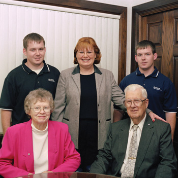 three generations of business at baker’s collision repair specialists: delee powell (center) with (clockwise from top left) sons charlie and chris and parents mervin and esther.