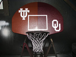 harris, a longhorn fan, struck a divine compromise with his local pastor, a sooner fan, on a basketball goal he sprayed and donated to the church. 