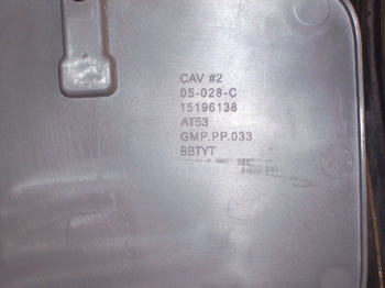Most plastic components have an ISO code like this one stamped on the back that will help you identify the type of plastic.
