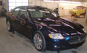 paint film thickness is a commonly observed aspect of used vehicles often noted by those in the automotive trade, particularly on exotic high value cars such as this maserati. the circled numbers above show the inconsistencies in film thicknesses of the various body panels measured in a post-repair inspection. 