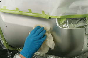 The area to be clearcoated should be cleaned with a tack rag to remove contaminants that may mar the finish.
