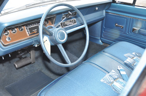 the interior of the valiant (above) and trunk with the original mat inside. note the original vehicle traveler sheet taped to the inner fender well.