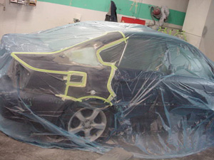 It’s a smart idea to completely bag the car before you apply primer to a repair.
