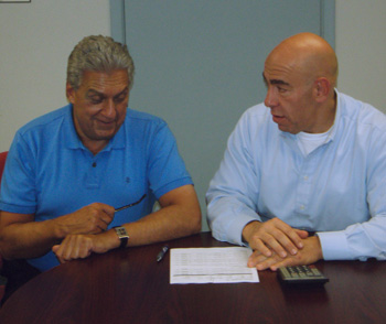 marketing and public relations manager lou fasolino (left) talks business with the boss.