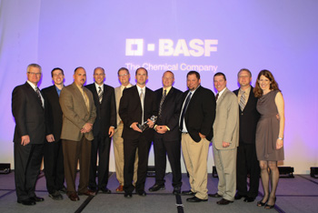 (Far left) Chuck Soeder, vice president, Automotive Refinish and Industrial Coatings Solutions for BASF, and (far right) Denise Kingstrom, strategic accounts manager, Automotive Refinish for BASF, present the Distributor of the Year Award to the Leading Edge team. Left to right are: Soeder, Travis Leybeck, Paul Derdich, Mike Priest, John Rang, Matt Johnson, David Brannon, Troy Schooley, Steve Balsley, Vaughn Lindberg and Kingstrom.