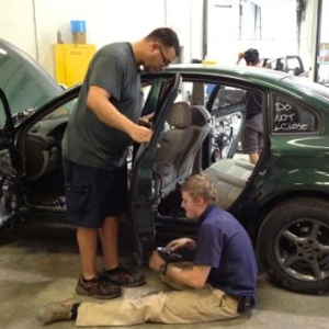 quality paint and body employees work on addison's volkswagen.