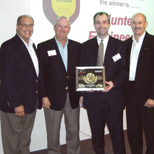 Ford Motor Company Director of Service Engineering Operations Mike Berardi (far left) and Ford Motor Company Manager of Technical Support Operations Steve DeAngelis (far right) presented the award to Hunter's VP of Key Accounts Greg Dunkin (second from left) and Director of OEM Programs Jeff Russell (second from right). 