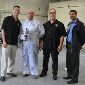(from left to right) John Darroch, president and CEO of Apollo;  Gabriel Frausto, painter at Cerritos Auto Body; Don Vargo, Apollo national sales manager; Roger Patel, owner of Cerritos Auto Body.