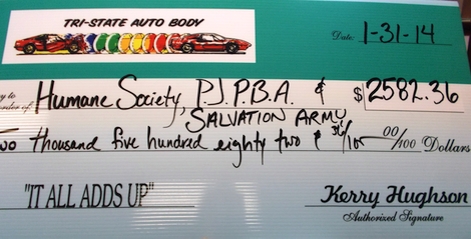 Tri-State Auto Body presents a check to to local organizations. 