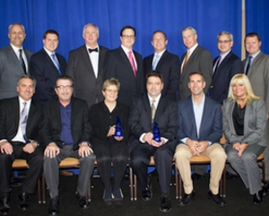 Sherwin-Williams representatives presented the Brand of the Year Award to DeVilbiss employees.