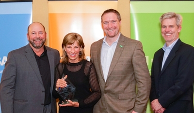 LaMettry Collision receiving the BASF 2013 Performance Group Shop of the Year Award. Pictured from left to right: Harold Thompson, business development manager, BASF; Joanne LaMettry, LaMettry’s Collision; Paul Whittleston, vice president automotive rRefinish and industrial coatings, BASF; John Moreau, zone manager, BASF.
