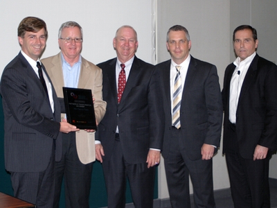 Hunter Executive Vice President Beau Brauer (far left)  and Hunter VP Key Accounts Greg Dunkin (center) accept the 2014 Partner in Transformation Award from Sears Manager Automotive Assets George Hoffman (second from left), Sears Director of Automotive Service Bob Hatton (second from right) and Sears Senior Vice President and President of Automotive Norm Miller (far right). 