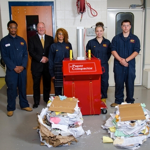 Gaithersburg High School collision repair students proposed to improve recycling efforts by investing in a paper compacter.