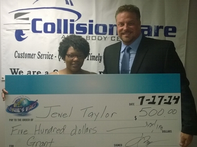 Jewel Taylor, winner of the $500 grant, with Lou Berman, Collision Care vice president of sales and president of Louie's Voice.