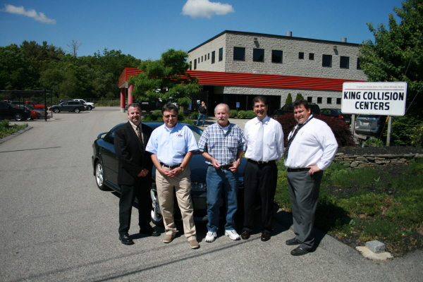 Ernie Menslage, on behalf of his wife Beth Menslage, accepts 2005 Mazda 6 from the Plymouth Safe Driving Campaign members. From left to right, Greg Bedrosian of Commerce Insurance, Bruce King from King Collision Centers, Ernie Menslage, Gary Maestas, Superintendent of Plymouth Public Schools and Chris Baker, Director of Technical Studies for Plymouth Public Schools. 