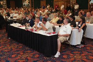 bodyshop business conference attendees listen to keynote speaker george avery.