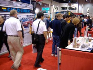 Attendees pound the floor in the Paint, Body & Equipment section of SEMA.