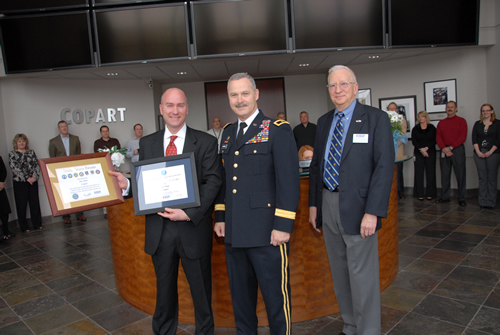 
Brigadier General Donald Currier and Robert O’ Anderson of Employer Support of the Guard and Reserve (ESGR) present CEO Jay Adair of Copart, Inc. with the “Seven Seals Award” and the “Above and Beyond Award.”  